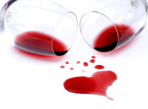 Red wine spilled from glasses